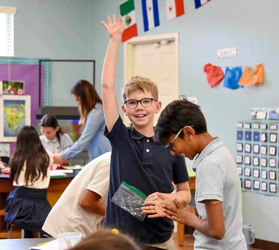 A teacher with her class inside a Del Mar Pines classroom